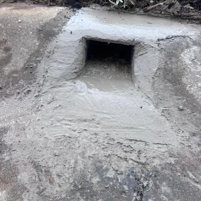 Stormwater kerb outlet cast into the gutter